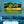 Tropical beach landscape wall art above blue velvet sofa in modern living room