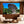 modern living room with beige chairs, marble coffee table, and large wall art of mushroom-shaped rock formation