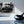 Black and white vintage car photo print hanging on a modern living room wall