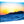Acrylic photo print of vibrant ocean waves with a rocky coastline at sunset