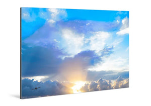 Acrylic photo print with glossy finish showing bright sunrise and clouds in vivid sky.