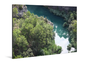 Acrylic photo print featuring a glossy landscape of trees and a river in vivid colors