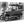 Acrylic photo print of a vintage car parked on cobblestone street, black and white wall art