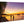 Acrylic photo print of people on a tropical beach at sunset with palm trees and boats