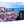 Glossy acrylic photo print featuring a colorful cityscape and ocean view.