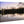 Acrylic photo print of sunset lake scene with tree and city reflections on glossy acrylic.