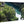 Glossy aluminum photo print featuring green forest and river landscape