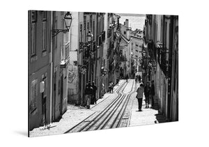 Black and white photo of a European city street with tram tracks on glossy aluminum panel
