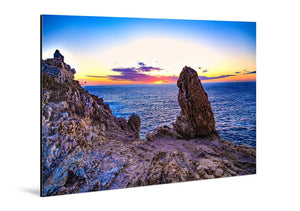 Glossy aluminum Dibond wall art showing rocky coast and sunset over blue ocean