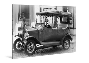 Black and white photo of a vintage car parked on a city street, printed on glossy aluminum Dibond.