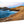 Glossy aluminum photo print of a vivid rocky coastline with blue waves at sunset
