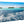 Aluminum photo print with glossy finish featuring tropical ocean and distant palm island