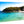 Glossy aluminum Dibond photo print featuring a scenic turquoise beach with swimmers and lush coastal cliffs.