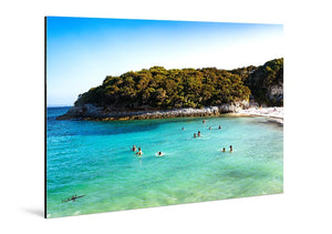 Glossy aluminum Dibond photo print featuring a scenic turquoise beach with swimmers and lush coastal cliffs.