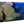 Glossy aluminum photo print featuring an aerial view of coral reefs and deep blue ocean water