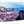 Glossy aluminum photo print of a colorful cityscape with historical buildings and ocean view