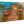 Direct print on wood of a tropical dock with boats, thatched hut, and clear turquoise water