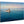 Direct print of boat on blue ocean with two people, displayed on natural wood panel