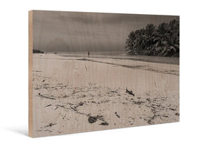 Direct print on wood featuring a beach scene with palm trees and person in the distance