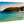 Direct print on wood featuring a beach scene with turquoise water and people swimming.