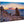 Scenic sunset seascape photograph printed on wood, featuring rocky cliffs and ocean view.