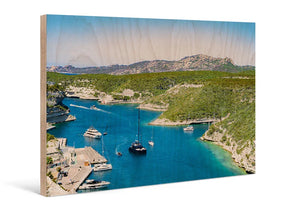 Direct print on wood featuring scenic coastal bay with yachts, clear blue water, and hills