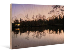 Fine art print on wood featuring a serene lake with trees reflected at dusk.