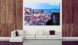 Modern living room with large cityscape wall art, white sofa, wood accent walls