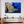 Framed coral reef ocean photo wall art in elegant living room with orange chairs