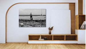 Modern living room with a black and white beach photography wall art, minimalist decor