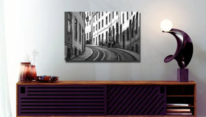 Modern living room with wall art of a black and white city street scene, urban decor