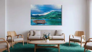 Modern living room with wooden furniture and a large wall art of a boat on a lake with green hills