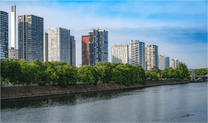 Photo couleur de Paris moderne au bord de la Seine avec immeubles contemporains, arbres et ciel bleu