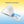 Open photo book with poetry and landscape photography on a blue-yellow gradient background