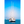 Sailboat anchored on calm blue sea under clear sky, with distant boats in background