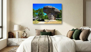 Modern bedroom with nature landscape wall art above bed, neutral colors, sunlight through window