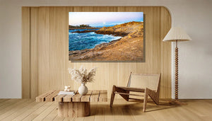 Coastal landscape wall art with rocky shore and blue sea in modern minimalist living room