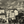 Vintage cityscape with statue, historic cathedral, old buildings and people in a European square