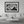 Modern living room with neutral decor featuring large black and white cityscape wall art.