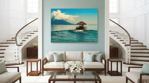 Modern living room with tropical boat wall art, staircase, and elegant neutral decor