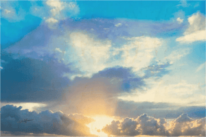 Sunrise or sunset sky with vibrant clouds and sunlight shining through, landscape photography