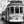 Vintage Lisbon tram on narrow city street, black and white urban photography