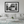 Modern living room with framed black and white city street tram wall art above sofa