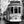 Black and white photo of Lisbon street with vintage tram and pedestrians