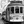 Black and white photo of vintage Lisbon tram on narrow city street with people walking