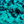 Underwater photo of sunlit sand, coral, and small fish in blue ocean