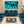 Modern waiting room with blue chairs, glass coffee table, and abstract ocean wall art.
