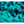 Underwater sand, coral, and small fish in clear turquoise ocean light