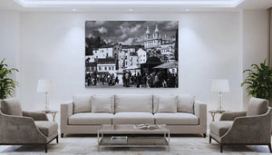 Modern living room with beige furniture, large black and white cityscape photo on wall