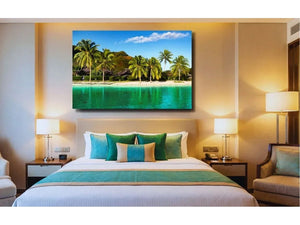 Modern hotel bedroom with tropical beach photo wall art above bed, turquoise accents throughout the room.